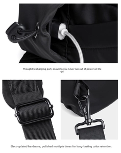 Detail of cross-body bag featuring an external USB charging port and durable metal hardware