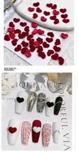 Macro view of red flocked heart nail charms with plush 3D velvet texture for manicures
