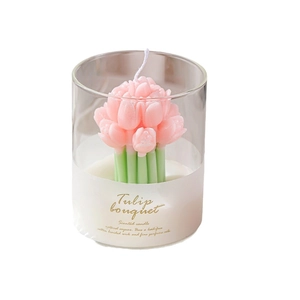 Pink tulip flower bouquet scented candle in glass cup for home fragrance and decor