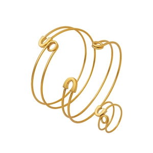 Adjustable golden spiral safety pin bracelet with U-shaped element on white background