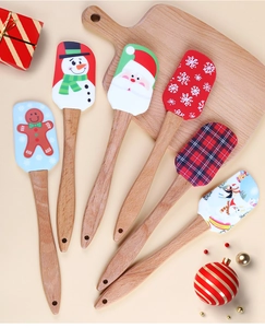 Detailed view of 6-piece Christmas silicone spatulas with wooden handles and festive patterns