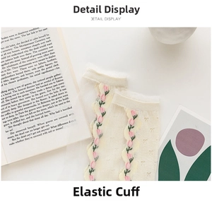 Detail of sheer socks with pink tulip embroidery and elegant wavy elastic cuffs