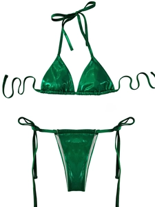 Detail of emerald green metallic bikini set with halter top and side-tie bottoms