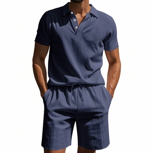 Detail view of dark blue waffle linen polo shirt and drawstring shorts set on model