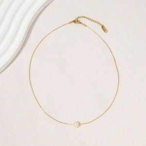 Minimalist gold titanium steel necklace with a single white freshwater pearl pendant