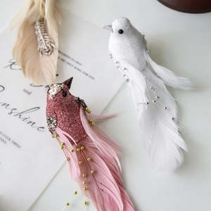 Glittery artificial feather birds in pink and white for Christmas tree decoration