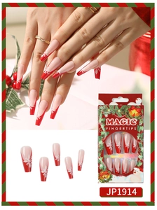 Detail of red French coffin press-on nails with white snowflake patterns and packaging