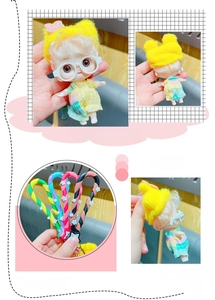Detail of cute doll keychain featuring flexible PVC strap and movable cartoon character