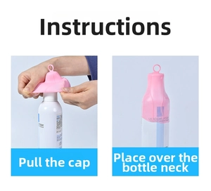 Detailed view of pink elastic silicone bottle sleeve being stretched onto a travel container