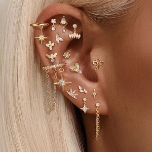 Detailed close-up of S925 sterling silver gold earrings set with zircon stars and flowers
