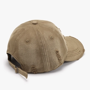 Vintage khaki distressed baseball cap with ripped details and adjustable metal buckle