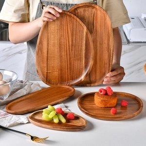 Natural acacia wood serving trays in various shapes for snacks, bread, fruit and cheese