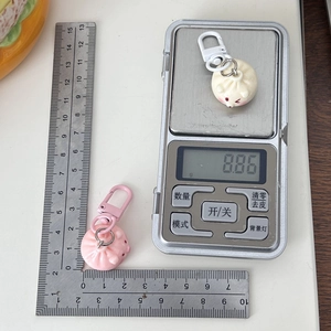 Cute steamed bun keychain pendant in pink and beige colors for bag decoration