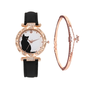 Close-up of rose gold cat watch with crystal bezel and matching star bracelet set