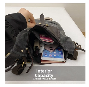 Macro view of inner storage capacity in dark grey canvas bag with leather trim