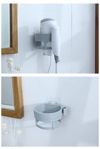 Detail showing wall-mounted hair dryer holder with integrated cord hooks and adhesive back