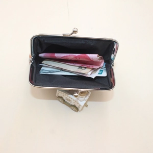 Abstract print retro clip purse with silver metal frame showing cash and card storage