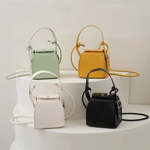 Modern PU leather geometric box handbag for women in mint, yellow, white and black
