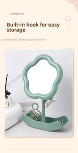 Close-up of cloud shaped vanity mirror with jewelry branch hooks and storage base