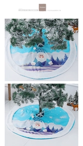 Close-up detail of plush LED blue Christmas tree skirt with Santa Claus and mountain patterns