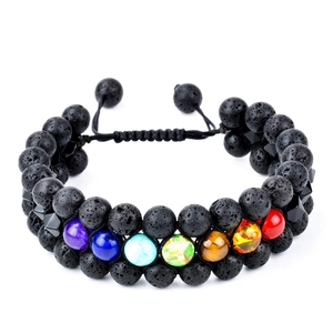 Detailed macro view of a double-layer black lava stone and seven chakra beads bracelet
