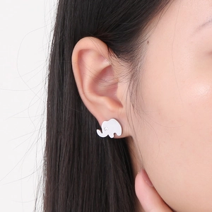 Detailed close-up of elephant stud earring with rhinestone worn on earlobe