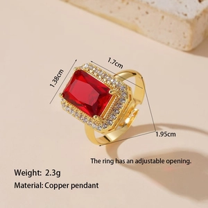 Detail shot of golden ring with red square gem and diamonds showing 1.95cm size specs