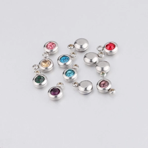 Close-up of 6.5mm stainless steel birthstone charms with colorful inlaid rhinestones