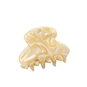 Minimalist marble pattern acetate hair claw clip in beige and white tones on white base