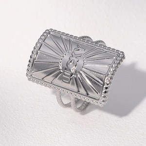 Macro shot of a silver Lucky engraved stainless steel ring with radial line design