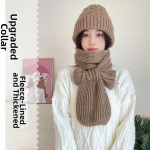 Detail of khaki cable knit hat and scarf set with fleece lining and buckle closure