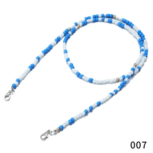 Detail of blue and white beaded lanyard with silver lobster clasps for masks or glasses
