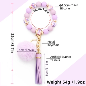 Detailed size chart of purple silicone bead keychain with pompom and tassel accents