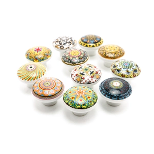 Detail view of various Bohemian ceramic cabinet knobs with vibrant mandala patterns.