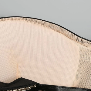 Close-up of mesh lining and metallic bead detail on a slim-fit sheer mesh dress