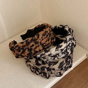 Braided leopard print headband set with a high-top design and woven fabric texture