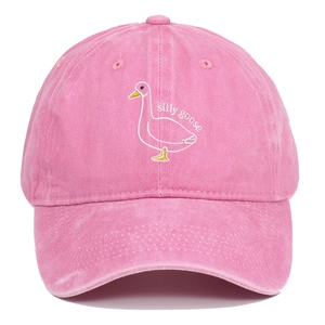 Close-up of silly goose embroidery on pink washed cotton baseball cap with high texture