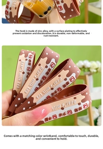 Detail of Bear's milk tea silicone wristlet strap with zinc alloy clasp for keychains