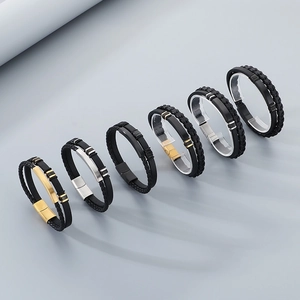 Detail showing dual-layer braided leather and silicone men's bracelet with metal clasp