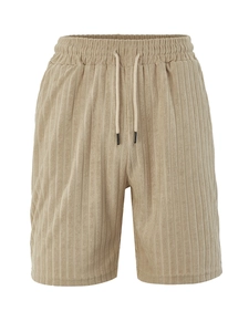 Detail of light khaki men's leisure shorts with elastic drawstring waist and textured fabric