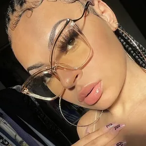 Cat eye blue light blocking glasses with champagne frame and sleek black metal temples