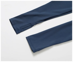 Detail view of navy blue yoga sleeve with functional thumbholes for secure athletic fit