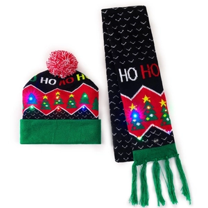Detail of LED glowing Christmas hat and scarf set with HO HO HO letters and trees