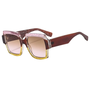 Retro oversized square sunglasses with pink and yellow glitter gradient frames and tinted lenses