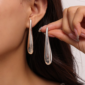 Polished silver teardrop earrings for women featuring a minimalist streamlined design