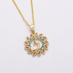 Detailed view of peacock pendant with pink and blue gemstones in 18K gold finish
