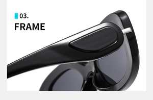 Macro shot of oval sunglasses featuring a glossy black frame and durable silver metal hinge