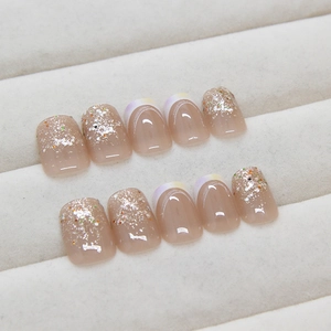 Short square press-on nails with nude base, silver glitter, and French gradient design