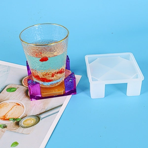 DIY flower square coaster silicone mold with finished resin piece and glass cup detail