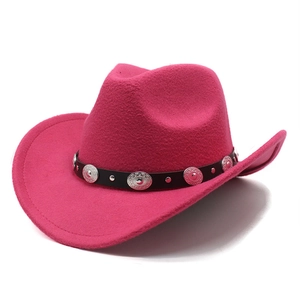 Close-up of hot pink western cowboy hat with silver concho studs and black leather band
